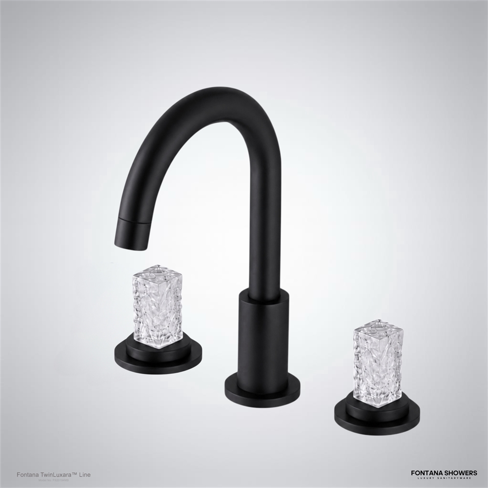 Close view of polished gold bathroom faucet and crystal handle details